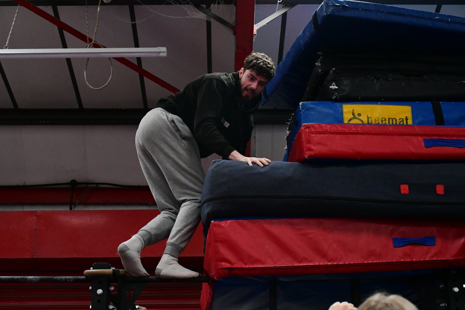 Coach guiding athletes during a strength session